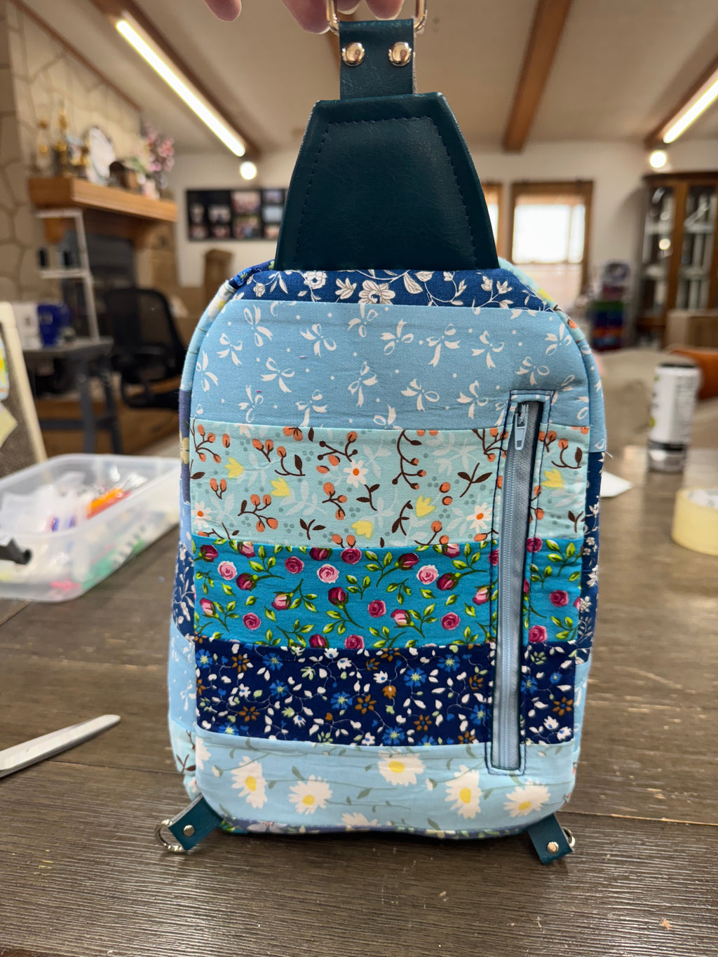 Blue quilted sling bag