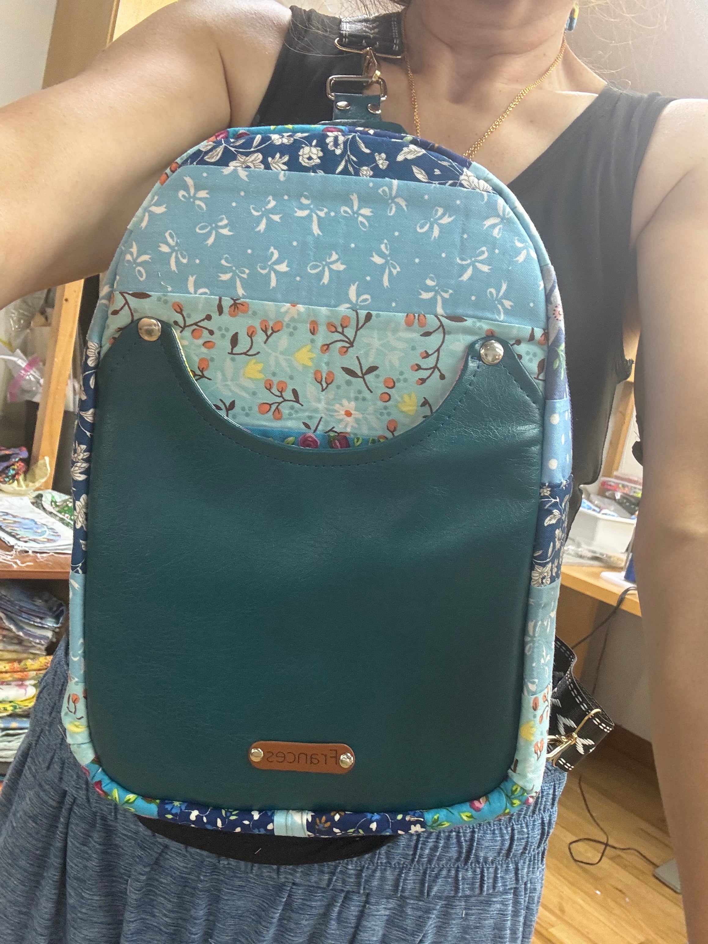 Blue quilted sling bag